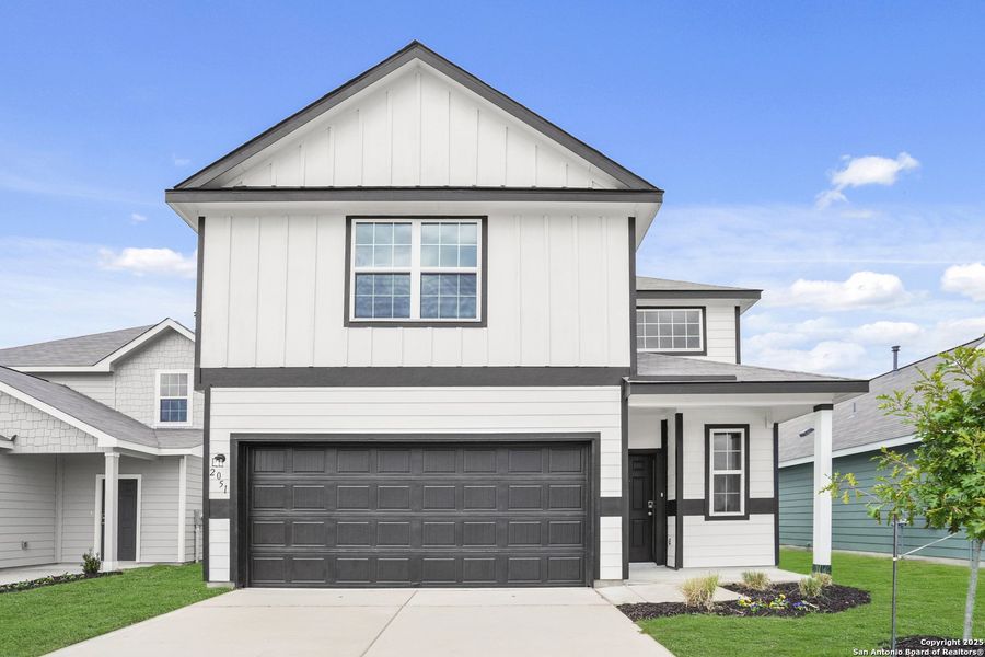 Front exterior of a new home in Dauer Ranch, New Braunfels, TX, highlighting curb appeal (Image 19). Front exterior of a new home in Dauer Ranch, New Braunfels, TX, highlighting curb appeal (Image 19).