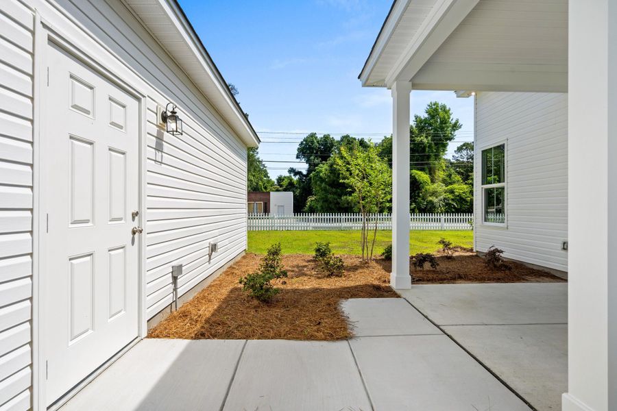 Exterior details and patio area of a home in Downtown Loris Homes, Loris (Image 31).