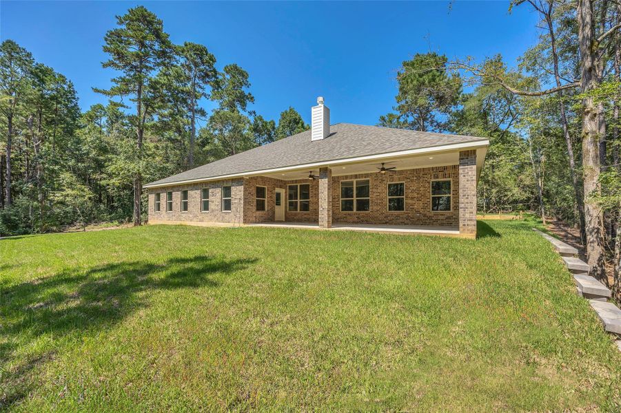 Exterior details and patio area of a home in , New Waverly (Image 2). Exterior details and patio area of a home in , New Waverly (Image 2).