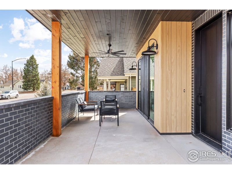 Covered front porch allows seamless connection to living space.