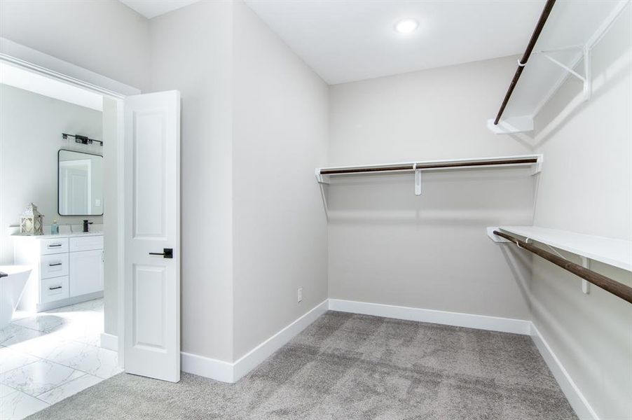 HUGE walk-in primary closet.