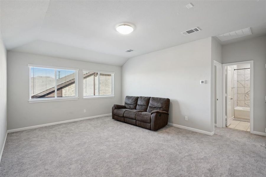 Living area with light colored carpet