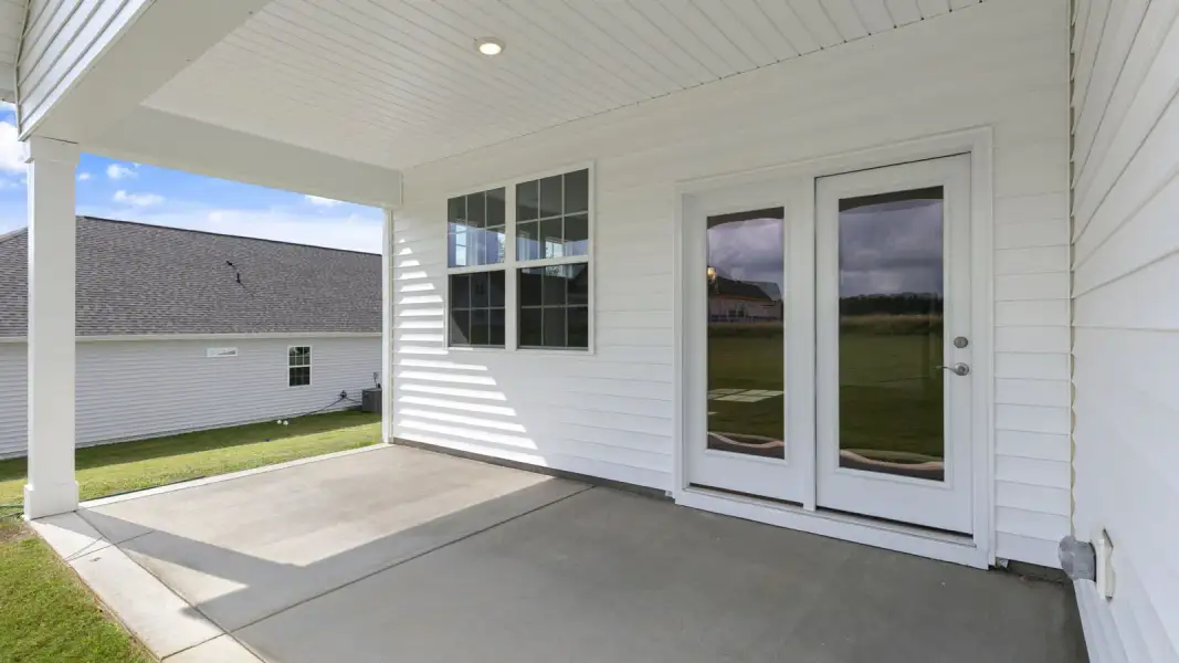 Exterior details and patio area of a home in The Villas at Galvins Ridge, Sanford (Image 4).