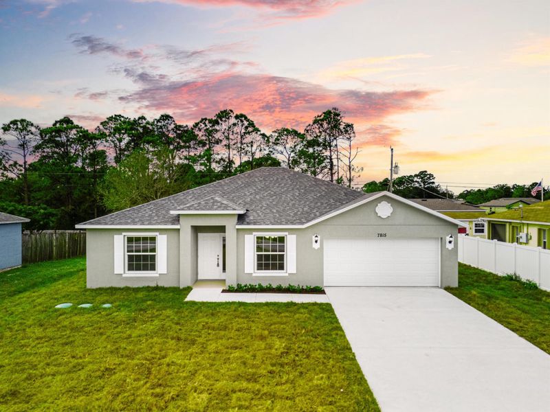 Front exterior of a new home in , Vero Beach, FL, highlighting curb appeal (Image 15).