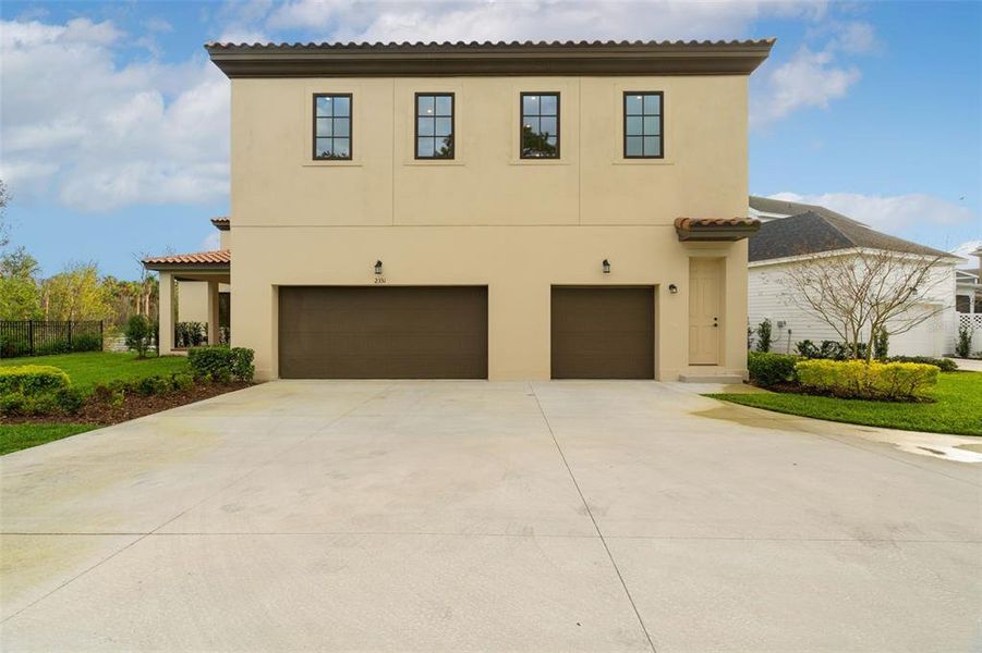 Front exterior of a new home in Celebration - Island Village, Celebration, FL, highlighting curb appeal (Image 32).