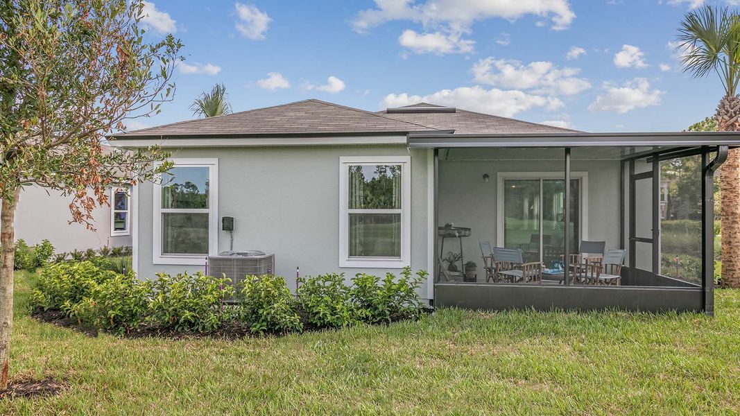 Front exterior of a new home in Grand Reserve, Bunnell, FL, highlighting curb appeal (Image 2).