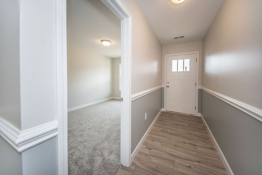 Representative unfurnished interior of a home built from the Quincy by Enchanted Homes in Hampshire Heights, Moore (Image 21).
