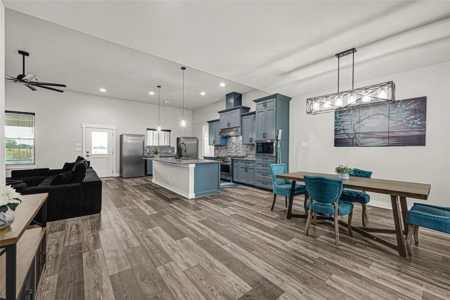 Open concept, with kitchen open to living room and dining room