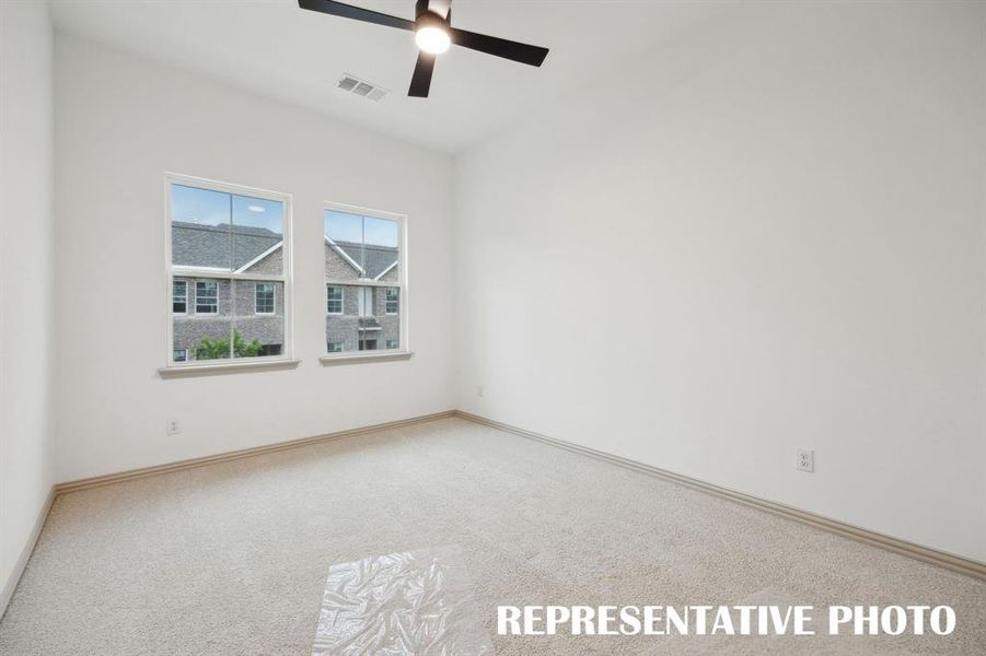 This light, bright owner's bedroom is the perfect place to relax and unwind at the end of the day.  REPRESENTATIVE PHOTO