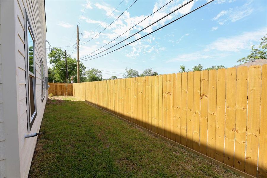 large side yard with potential for home garden.