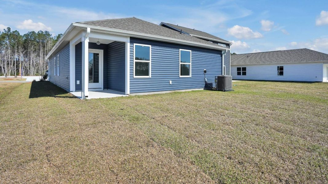 Exterior details and patio area of a home in Lockwood Landing, Supply (Image 3).