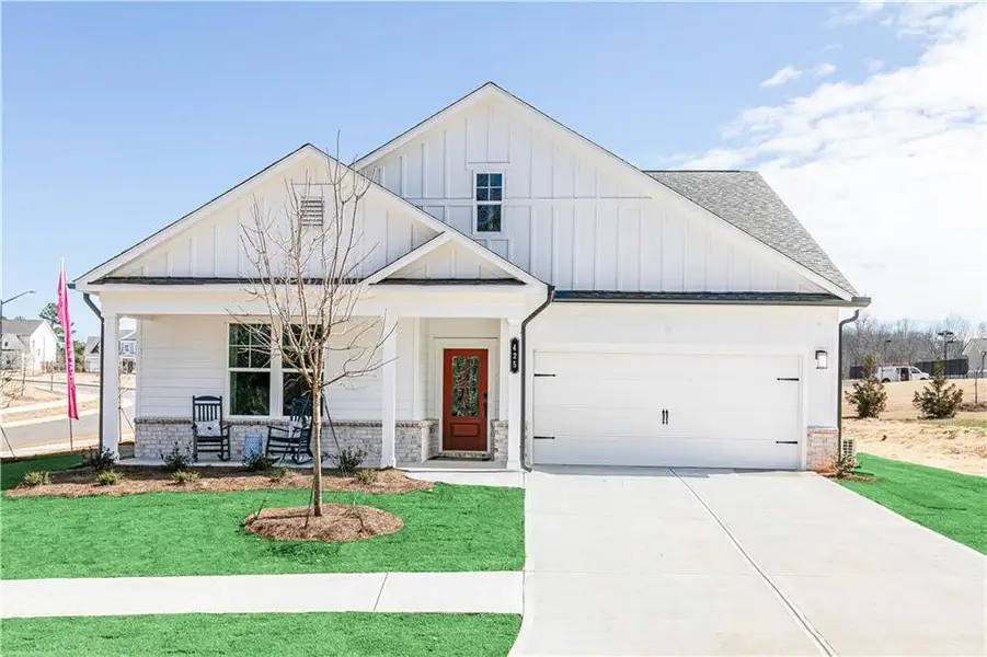 Front exterior of a new home in Madison at Buice Lake, Acworth, GA, highlighting curb appeal (Image 1). Front exterior of a new home in Madison at Buice Lake, Acworth, GA, highlighting curb appeal (Image 1).