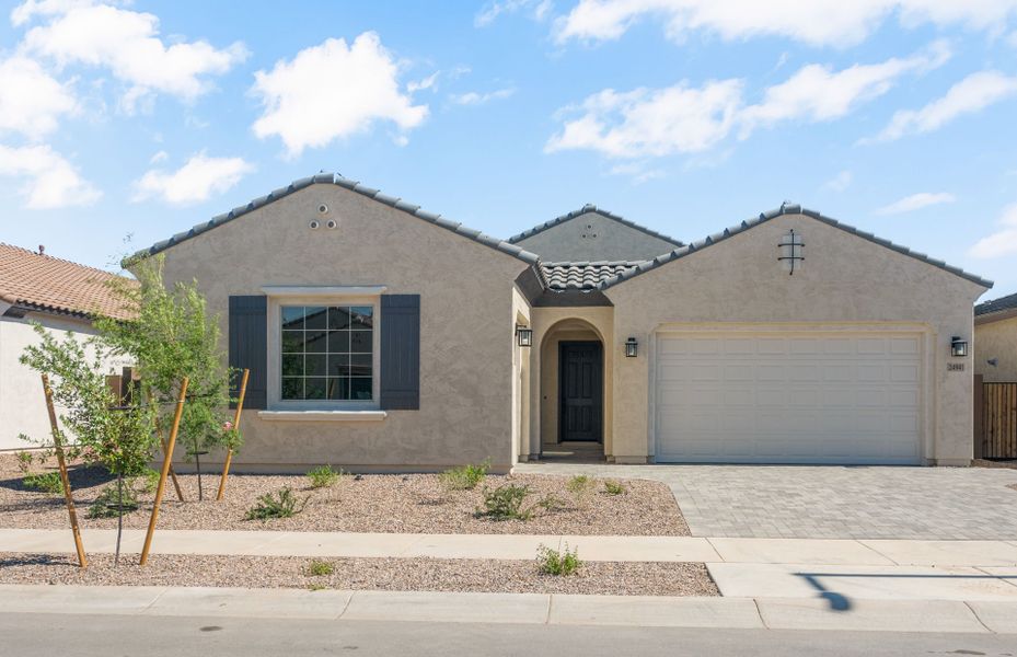 Front exterior of a new home in Artisan at Asante, Surprise, AZ, highlighting curb appeal (Image 27).