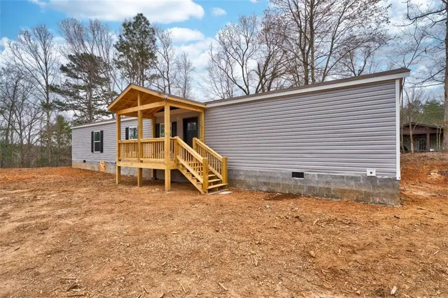Exterior details and patio area of a home in , Ellijay (Image 13).