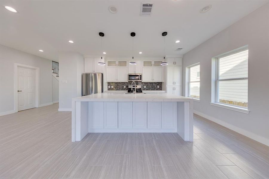 This open kitchen is perfect for hosting meals and parties!