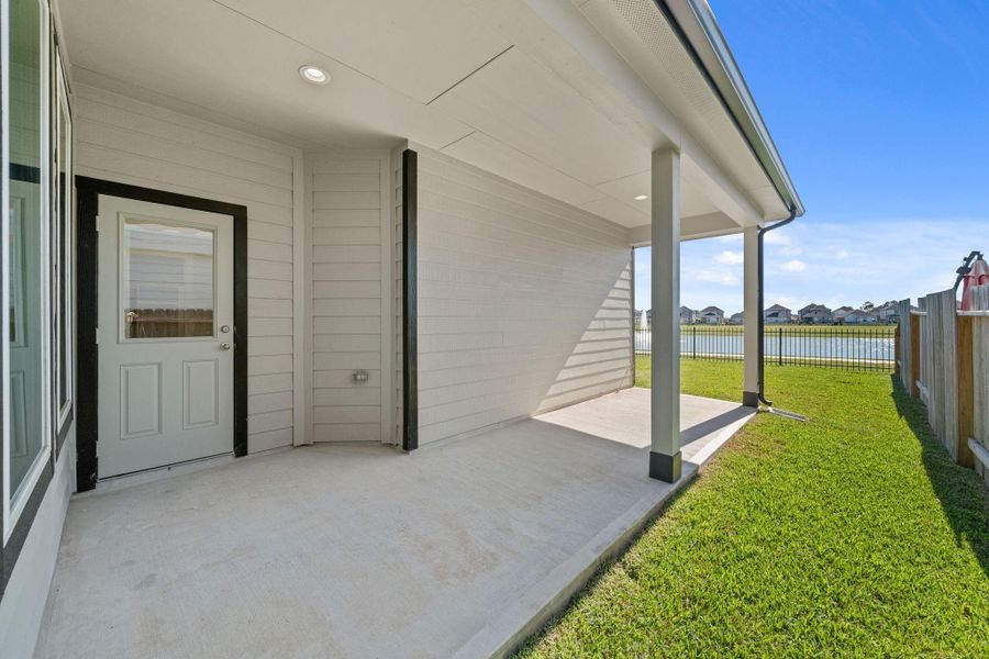Exterior details and patio area of a home in Grand Oaks Village, Houston (Image 3).