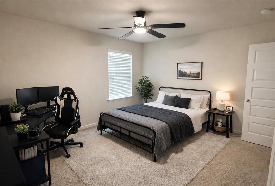 Bedroom featuring light carpet, ceiling fan, and an office area
