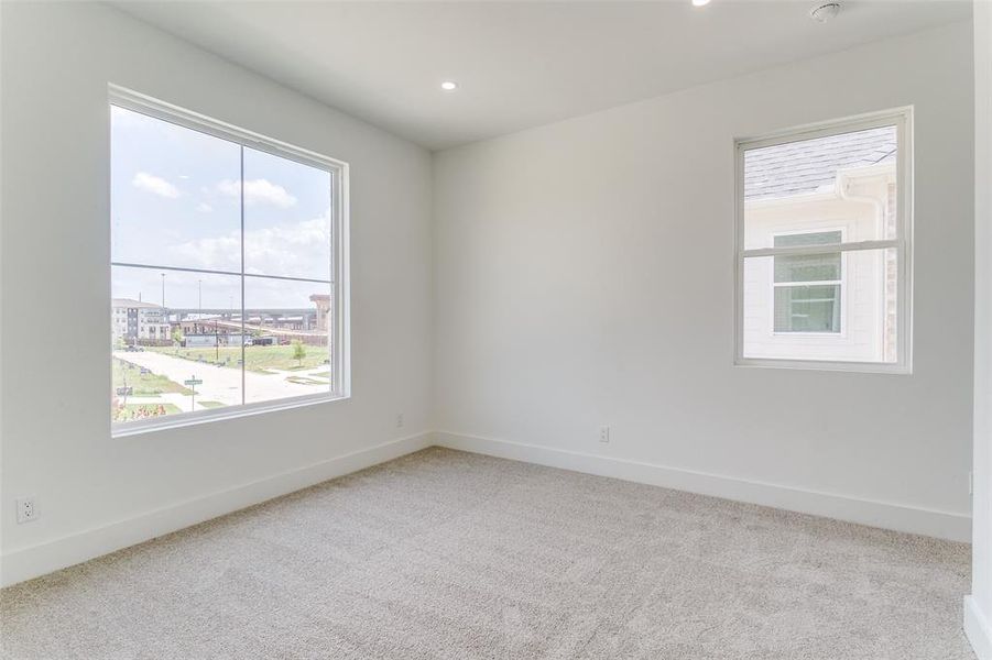 Empty room featuring carpet flooring and recessed lighting Empty room featuring carpet flooring and recessed lighting