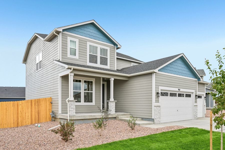 Front exterior of a new home in The Glen, Colorado Springs, CO, highlighting curb appeal (Image 22). Front exterior of a new home in The Glen, Colorado Springs, CO, highlighting curb appeal (Image 22).