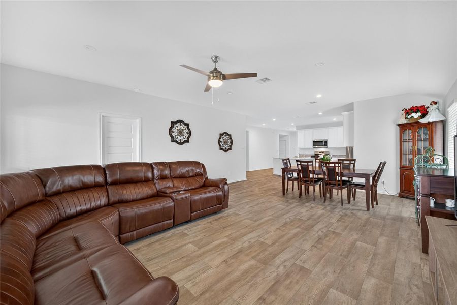 Floor-to-ceiling windows flood the living spaces with natural light, creating a warm and inviting ambiance.