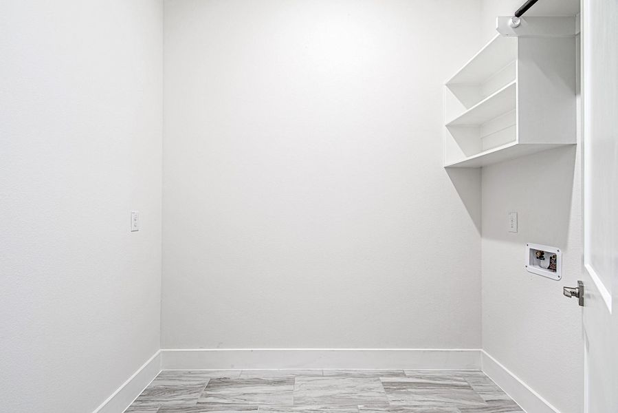 The dedicated laundry room with built-in shelving and space to move—designed to keep your household running like a well-oiled machine. The dedicated laundry room with built-in shelving and space to move—designed to keep your household running like a well-oiled machine.