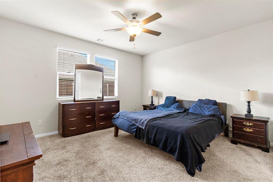 Bedroom with light carpet and ceiling fan Bedroom with light carpet and ceiling fan