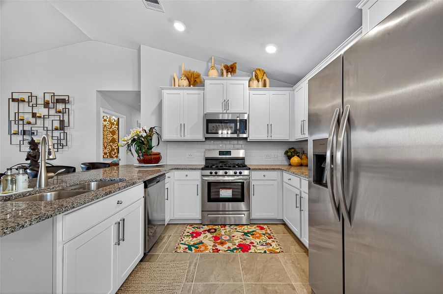 Furnished interior view inside a new home in Sunterra, Katy (Image 37).