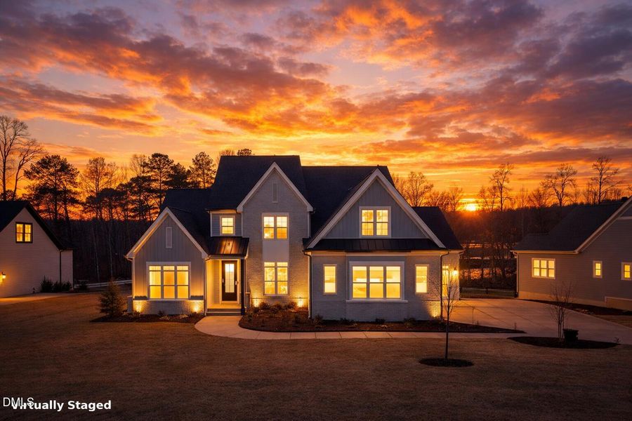Modern farmhouse at sunset
