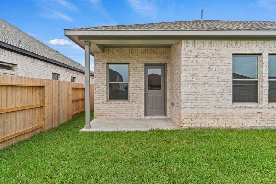 Exterior details and patio area of a home in Windrose Green, Angleton (Image 3).