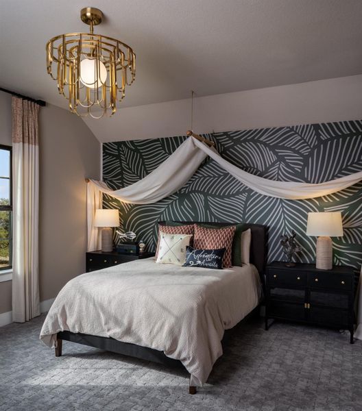 Carpeted bedroom with a chandelier and baseboards Carpeted bedroom with a chandelier and baseboards