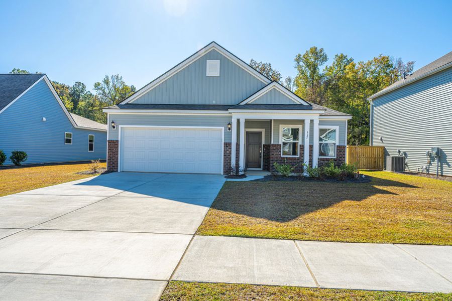Front exterior of a new home in Cedar Glen Preserve, Huger, SC, highlighting curb appeal (Image 2).