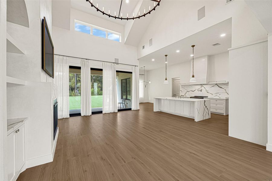 Open living area with high ceilings, custom finishes and abundant natural light.Custom sliding doors to transition between indoor and outdoor living living.