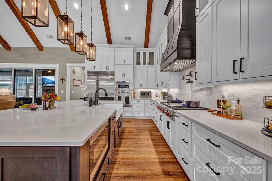 Chef's delight Kitchen w/custom floor-to-ceiling cabinets and quartz countertops. Wolf, Sub-Zero appliances.