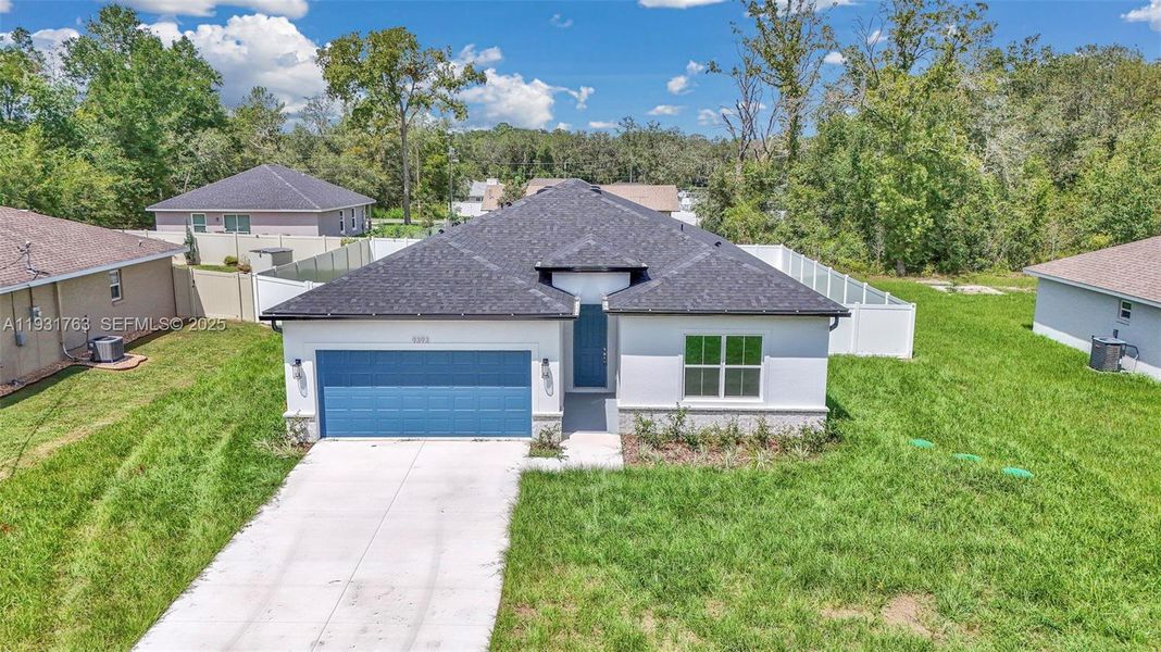 Front exterior of a new home in , Summerfield, FL, highlighting curb appeal (Image 19). Front exterior of a new home in , Summerfield, FL, highlighting curb appeal (Image 19).