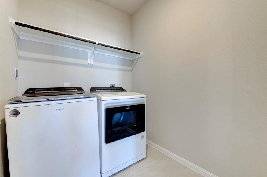 Second-floor laundry area with convenient access and dedicated utility space.
