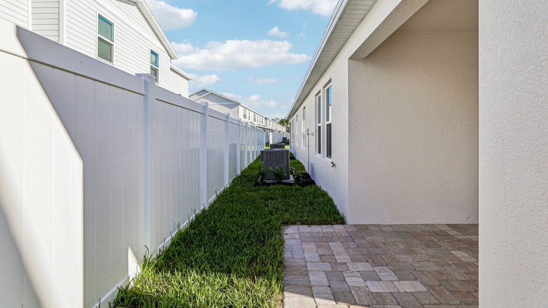 Exterior details and patio area of a home in Cyrene at Harmony, St. Cloud (Image 21).