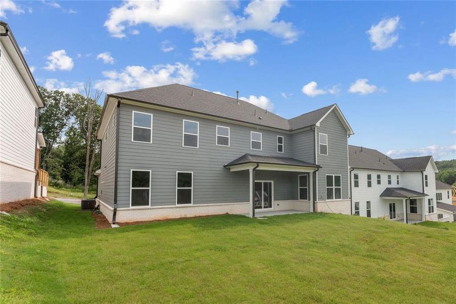 Exterior details and patio area of a home in The Estates at Gainesville Township, Gainesville (Image 3).