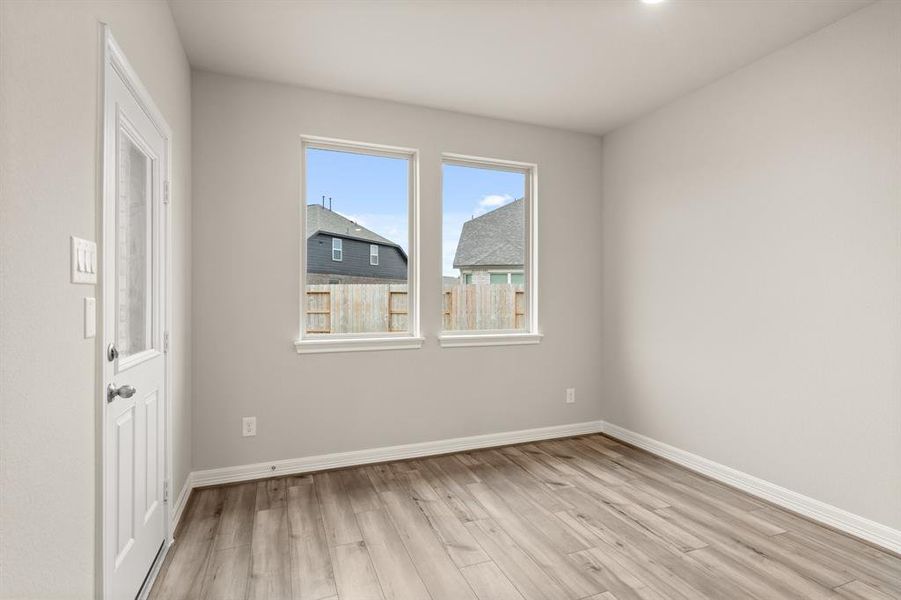 With an abundance of natural light streaming through the windows, the breakfast nook is bathed in a sunny glow, creating the perfect atmosphere to enjoy your morning coffee or a family breakfast.