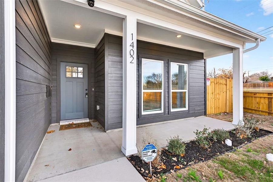 View of exterior entry featuring a porch