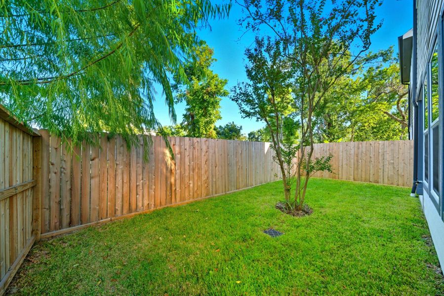 A fully fenced backyard provides a great space for playtime. A fully fenced backyard provides a great space for playtime.