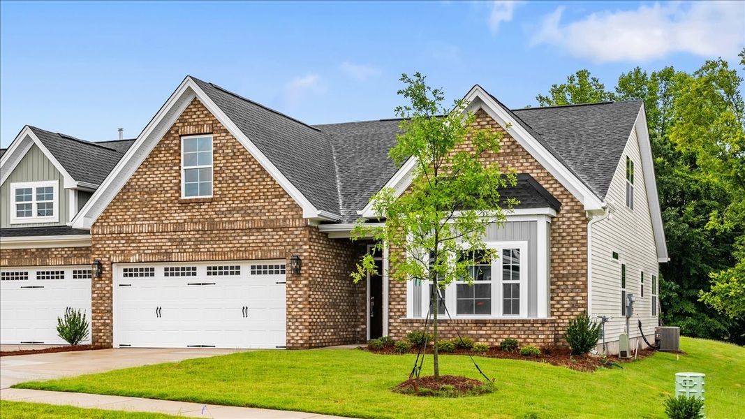 Front exterior of a new home in Fieldstone, Lexington, NC, highlighting curb appeal (Image 21). Front exterior of a new home in Fieldstone, Lexington, NC, highlighting curb appeal (Image 21).