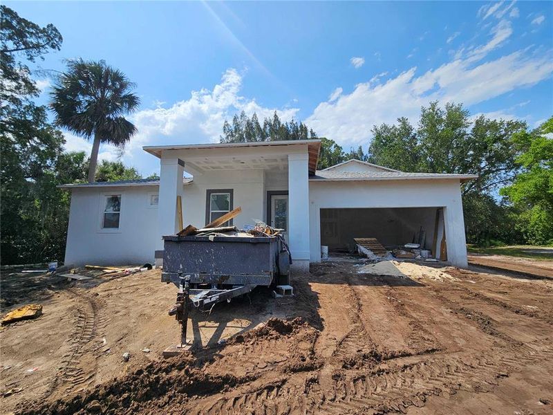 Front exterior of a new home in , New Smyrna Beach, FL, highlighting curb appeal (Image 9).