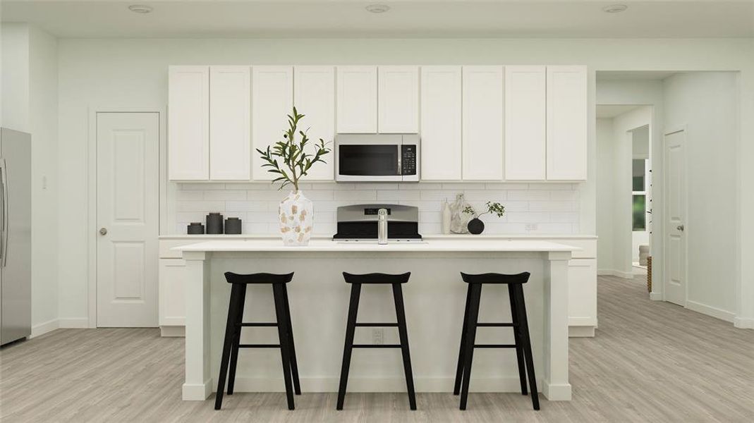 Kitchen with white cabinetry, stainless steel appliances, tasteful backsplash, light hardwood / wood-style floors, and a kitchen island with sink