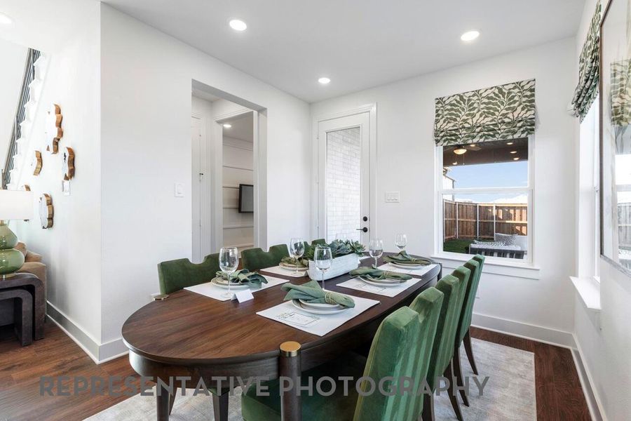 A dining room with windows fills the space with natural light, creating a warm and inviting atmosphere for meals and gatherings.