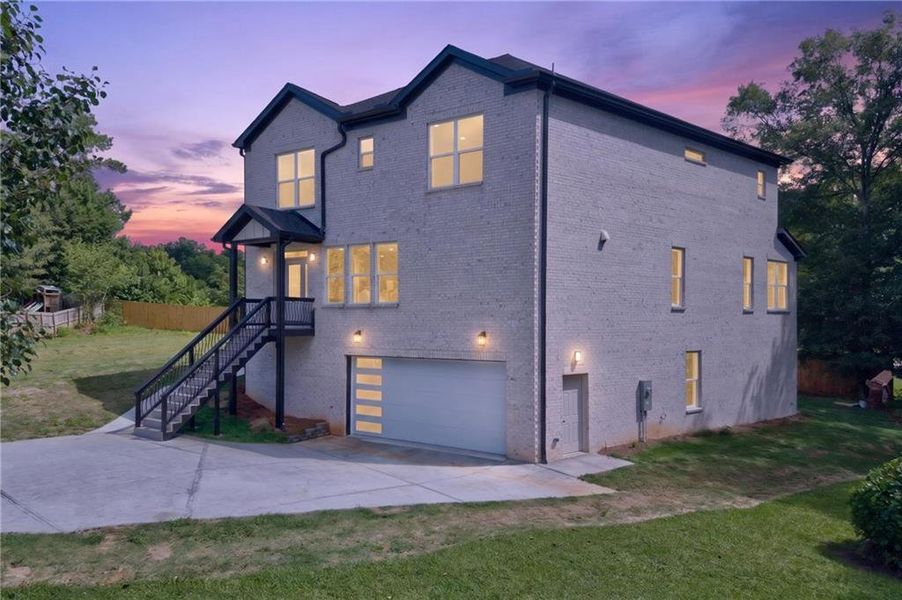 Front exterior of a new home in , Loganville, GA, highlighting curb appeal (Image 27). Front exterior of a new home in , Loganville, GA, highlighting curb appeal (Image 27).