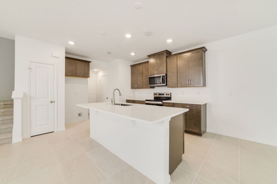 Furnished interior view inside a new home in Towns at Greenleaf, Oviedo (Image 7).