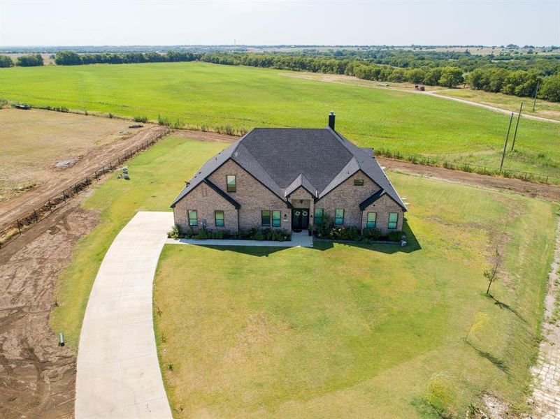 Front exterior of a new home in , Krum, TX, highlighting curb appeal (Image 21). Front exterior of a new home in , Krum, TX, highlighting curb appeal (Image 21).