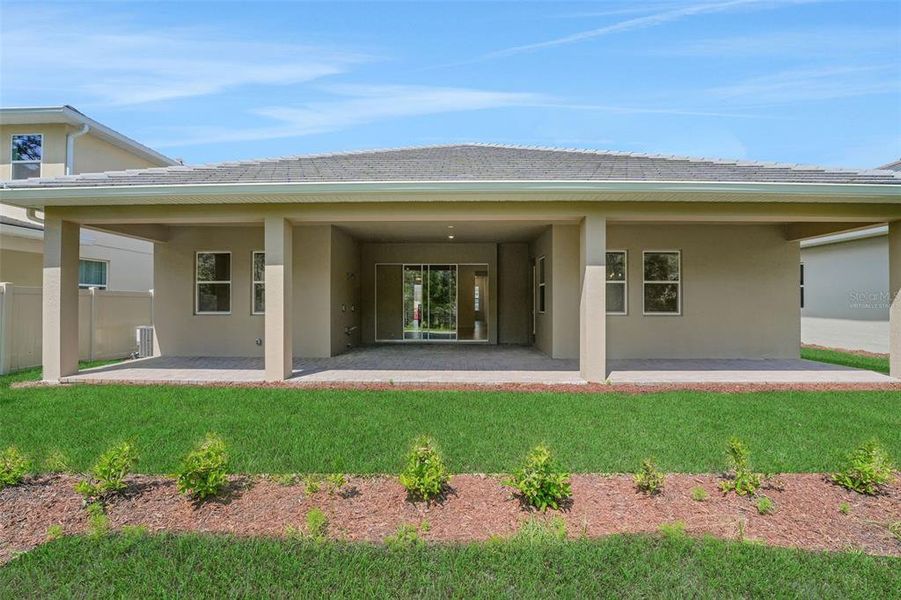 Exterior details and patio area of a home in Palms at Windermere, Windermere (Image 23).