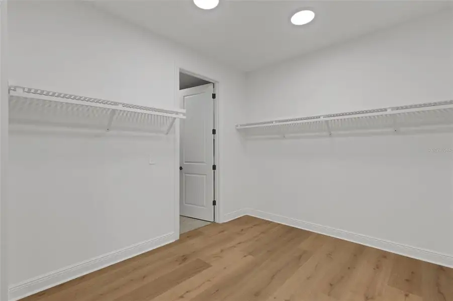 Spacious, unfurnished interior of a new home in Cassata Lakes, Nokomis (Image 56).