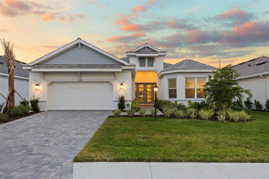 Front exterior of a new home in , Lakewood Ranch, FL, highlighting curb appeal (Image 21).